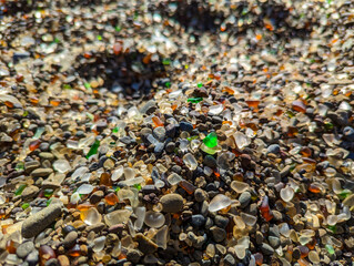 Smooth sea glass on beach