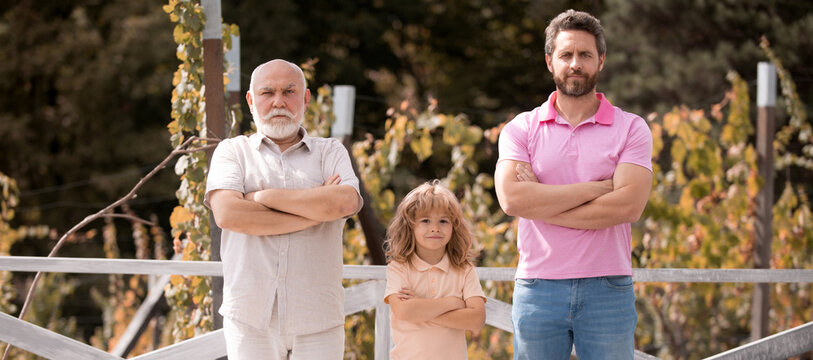 Male Generation Family Together With Three Different Generations Ages Grandfather Father And Son In Summer Garden.