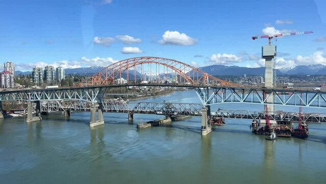 road from Surrey Vancouver the view from the sky train to the bridge and the Pacific Ocean which is located on the Fraser River on both sides of the long Burrard Bay. High quality 4k footage.