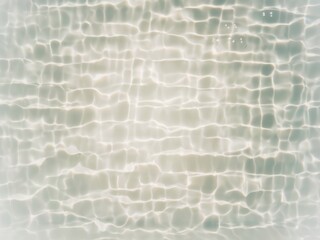 Defocus blurred transparent blue colored clear calm water surface texture with splashes and bubbles. Trendy abstract nature background. Water waves in sunlight with copy space. Blue water shine