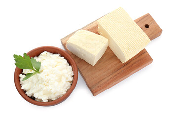 Different types of delicious tofu cheese with parsley on white background, top view