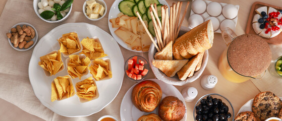 Different tasty food for brunch on wooden table, flat lay. Banner design