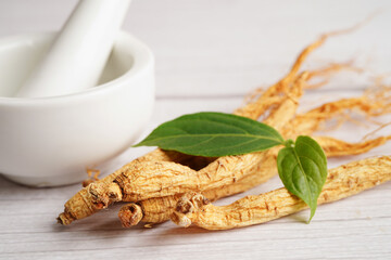 Ginseng roots and green leaf, healthy food.