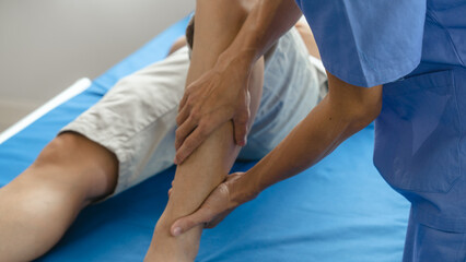 Athlete undergoing physiotherapy with a musculoskeletal specialist after sports and gym injuries.