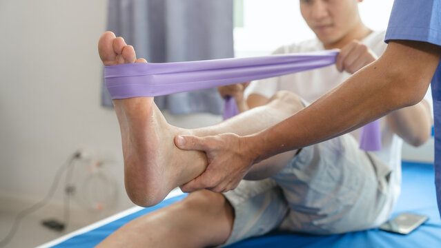 Athlete Undergoing Physiotherapy With A Musculoskeletal Specialist After Sports And Gym Injuries.