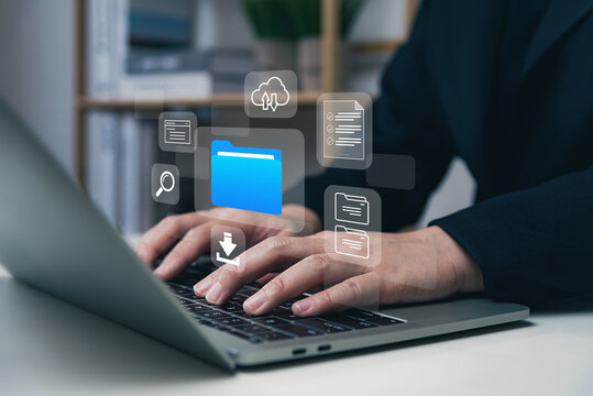 Document folder management system DMS concept, businessman using laptop connecting to digital file, data transfer backup, digital transformation, file sharing, search and managing files.