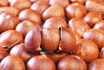 Closeup of chestnuts in a market stall. Shallow depth of field