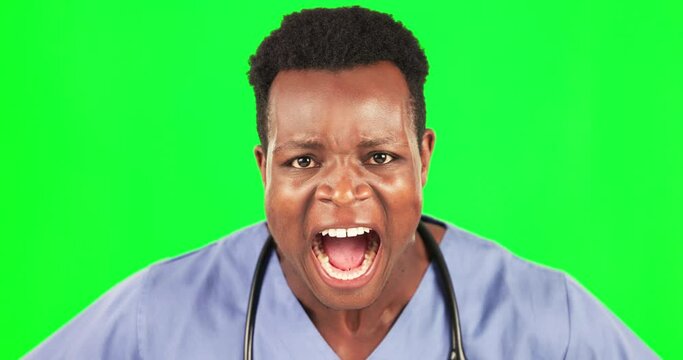 Doctor, scream and face of black man in green screen, angry in studio, stress and yelling on mockup background. Healthcare, shout and portrait of African nurse with anxiety or failure isolated