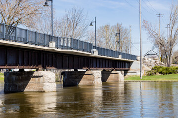 A pedestrian and bicycle bridge over a river built on an old railroad bridge.