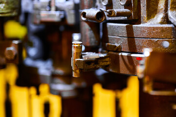 Clamp with brass bullet casing at ammo production plant