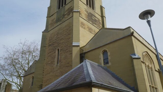 Handheld tilt up reveals gorgeous turret architecture of English building