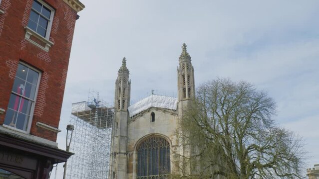 Large glass windows of stone cathedral under construction in Cambridge England
