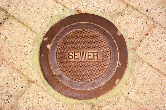 Vintage Utility Manhole Cover Conveys An Aging Industrial Era