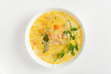 Creamy fish soup with salmon, potatoes, onions , carrots, dill and celery