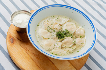 dumpling with broth and sour cream