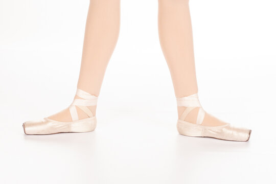 En Pointe CORRECT Second position showing calves front on teachers perspective Close up of young female ballet dancer showing various classic ballet feet positions pointe