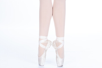 En Pointe CORRECT showing calves front on teachers perspective Close up of young female ballet dancer showing various classic ballet feet positions