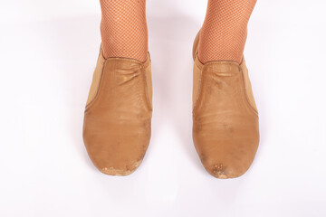 Tan Jazz INCORRECT standing feet position front on teacher perspective Close up of young female ballet dancer showing various classic ballet feet positions 