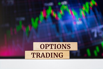 Wooden blocks with words 'options trading'. Business concept