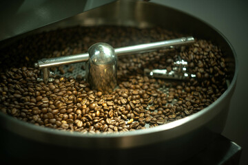 Freshly roasted coffee beans in a roaster