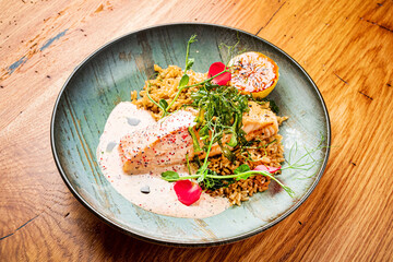 salmon steak with rice and sauce