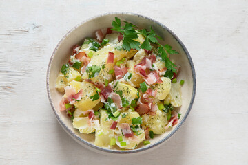 Kartoffelsalat - traditional German potato salad. Potato salad with bacon.