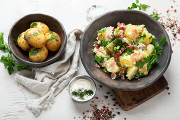 Kartoffelsalat - traditional German potato salad. Potato salad with bacon.