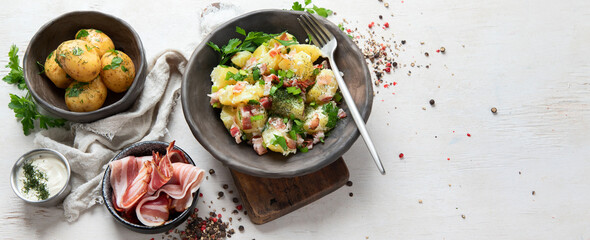 Kartoffelsalat - traditional German potato salad. Potato salad with bacon.
