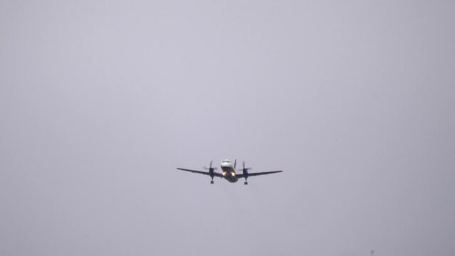 A Saab 2000 Turboprop Passenger Airliner Taking Off on a Cloudy Day.