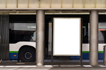 Blank billboard in portrait format at a bus station in Lugano.