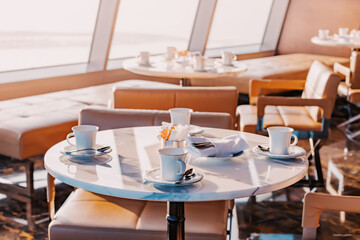 Rooftop aerial viewpoint cafe empty tables with cups in skyscraper