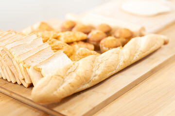fresh bread and wheat on the wooden. Fresh fragrant bread on the table. Food concept.