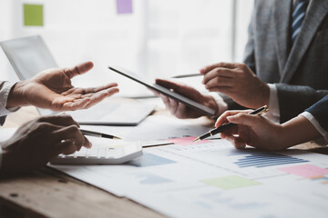 Atmosphere of a startup company meeting, business people are meeting together to summarize and plan investment finances, they are the founders of the company. Business administration concept.