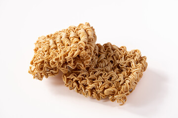 Instant noodles, a dried and precooked noodle block isolated on white background.