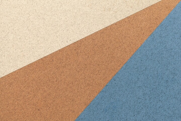 Texture of old craft beige, brown and gray color paper background, macro. Vintage abstract blue cardboard