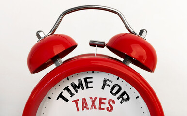 Red alarm clock with text Time For Taxes