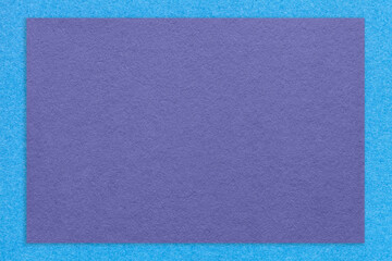 Fototapeta premium Texture of craft violet color paper background with blue border, macro. Structure of vintage kraft very peri cardboard
