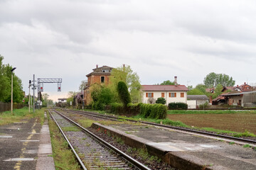 Fototapeta na wymiar Station train railway panorama landscape characteristic tracks house building cloud