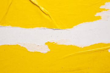 Old grunge ripped torn yellow paper poster surface texture background