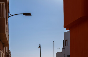 Street lamps on a small town against sky. Almeria, Spain