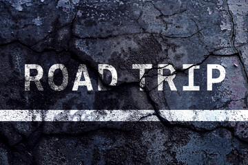 Road trip text written with broken cement wall, road trip word on street. Concept for travel.