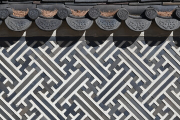 Brick wall background with traditional Korean patterns