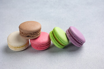 Pile of Macaroon or Macaron Biscuits on Grey Background
