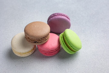 Pile of Macaroon or Macaron Biscuits on Grey Background
