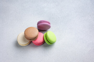 Pile of Macaroon or Macaron Biscuits on Grey Background
