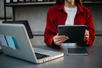 businesswoman hand working with new modern computer using on smartphone and tablet as concept..