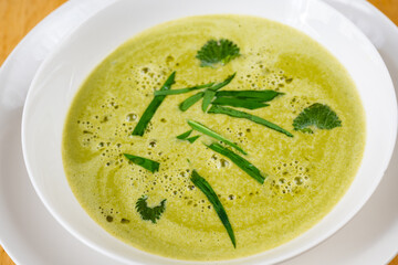 Spring soup from bear garlic and nettle. - 592556317
