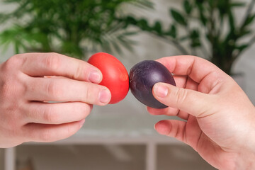 Two people are beating Easter eggs. tradition for Easter.