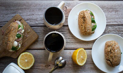 Sandwiches with mozzarella and ham. on a wooden background