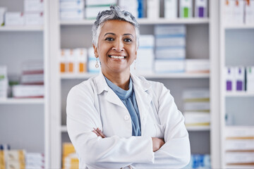 Senior woman, pharmacist and arms crossed in portrait for healthcare, medicine or entrepreneurship at store. Female pharma expert, happy and excited face for small business, service and wellness shop - Powered by Adobe